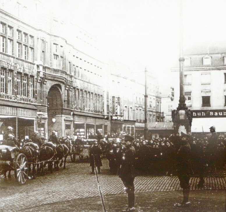 Jews as they are rounded up and marched down a street in Lvov. -  Collections Search - United States Holocaust Memorial Museum